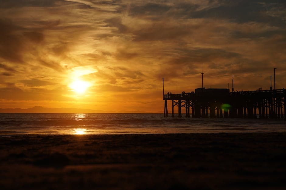 Newport Beach coastline with pier and sandy shores