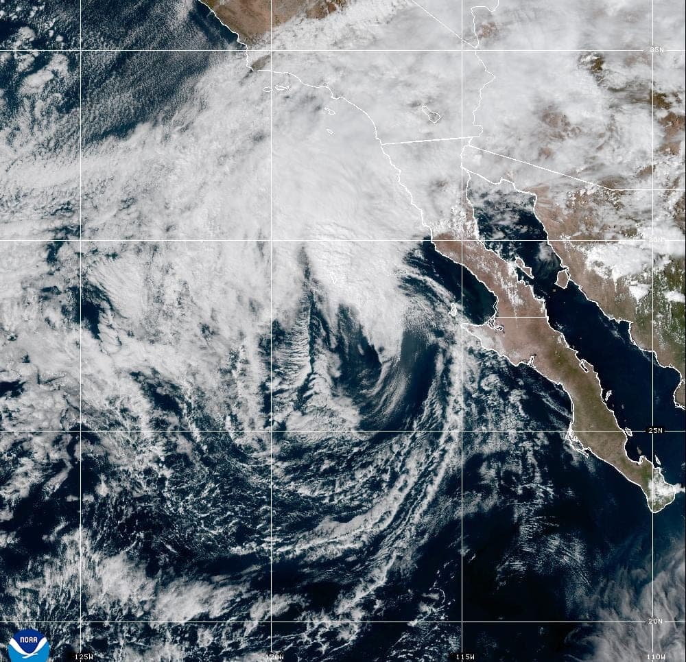 GOES-West satellite view of Tropical Storm Rachel's sheared swirl of cloud off the Pacific coast of Baja California, with its moisture streaming north over Southern California
